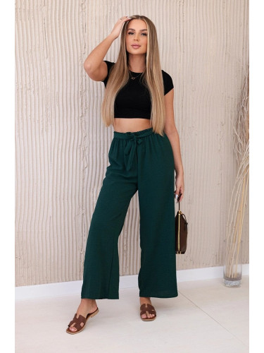 Wide-waisted trousers in dark green colour