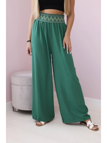 Trousers with a wide elastic waistband in green colour