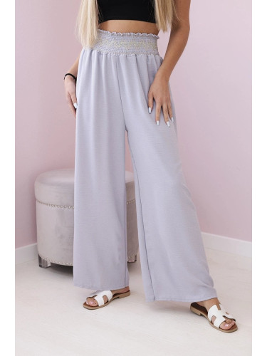 Grey trousers with a wide elastic waistband