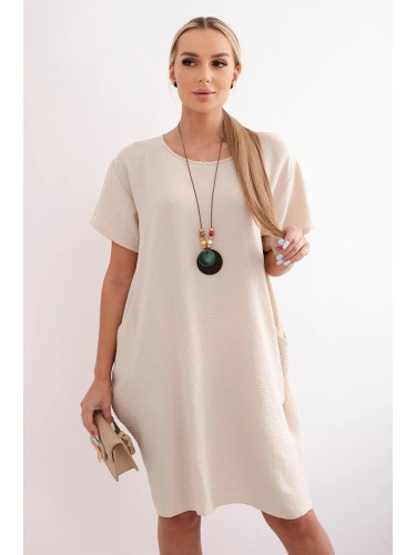 Loose dress with pockets and a pendant, dark beige