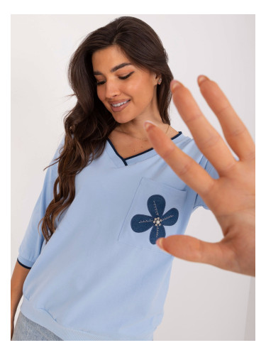 Light blue cotton blouse with floral motif