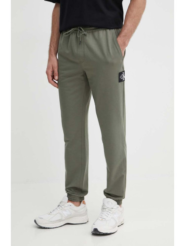 Спортен панталон Calvin Klein Jeans в зелено с апликация J30J325336