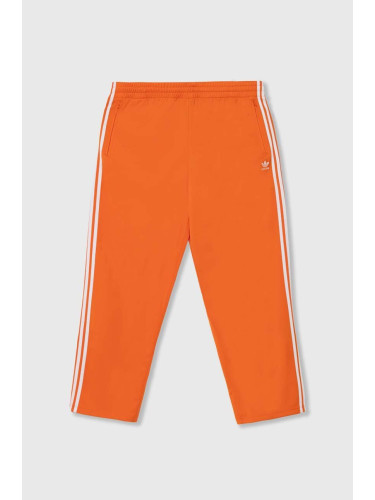 Спортен панталон adidas Originals в оранжево с апликация IR9894