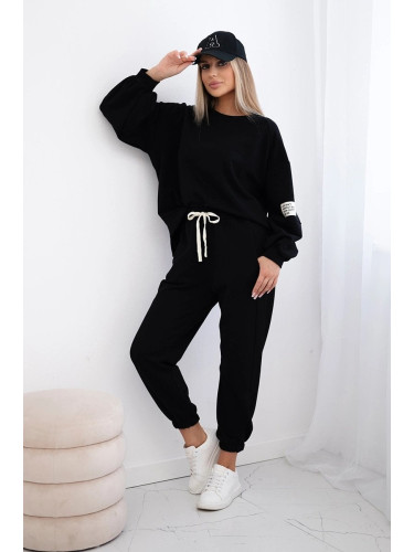 Cotton sweatshirt with a longer back + black trousers