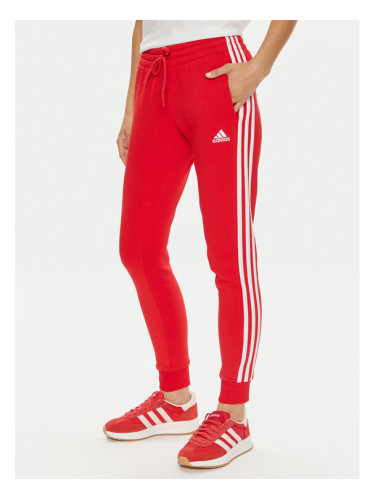 adidas Долнище анцуг Essentials 3-Stripes IY1719 Червен Slim Fit