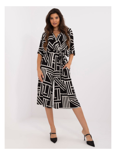 Black patterned jumpsuit with tie on the back